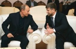 RUSSIA -- Presiden Vladimir Putin (Left) talks to Chechen head Ramzan Kadyrov at Novo-Ogaryovo residence.