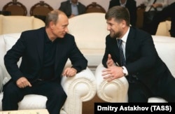 RUSSIA -- Presiden Vladimir Putin (Left) talks to Chechen head Ramzan Kadyrov at Novo-Ogaryovo residence.