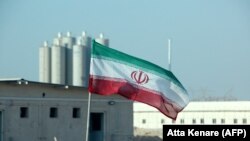 An Iranian flag in Iran's Bushehr nuclear power plant, during an official ceremony to kick-start works on a second reactor at the facility, November 10, 2019. (Atta Kenare/AFP)