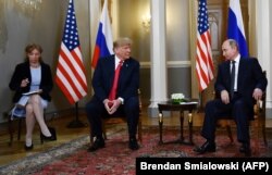 FINLAND -- Russian President Vladimir Putin (R) and U.S. President Donald Trump (2L) attend a meeting in Helsinki, July 16, 2018