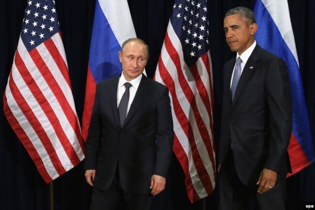 U.S. -- Russian President Vladimir Putin (L) and US President Barack Obama (R) pose for photographs before the start of a bilateral meeting at the United Nations headquarters in New York City, New York, USA, 28 September 2015.