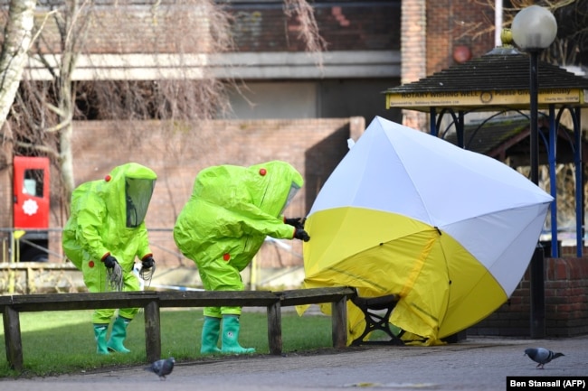 Forensic police officers wearing hazmat suits at the home of Sergei Skripal in Salisbury, England.