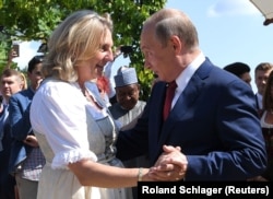 AUSTRIA -- Austrian Foreign Minister Karin Kneissl dances with Russian President Vladimir Putin at her wedding in Gamlitz, August 18, 2018
