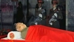 The body of North Korean leader Kim Jong Il is laid in a memorial palace in Pyongyang, North Korea, December 20, 2011