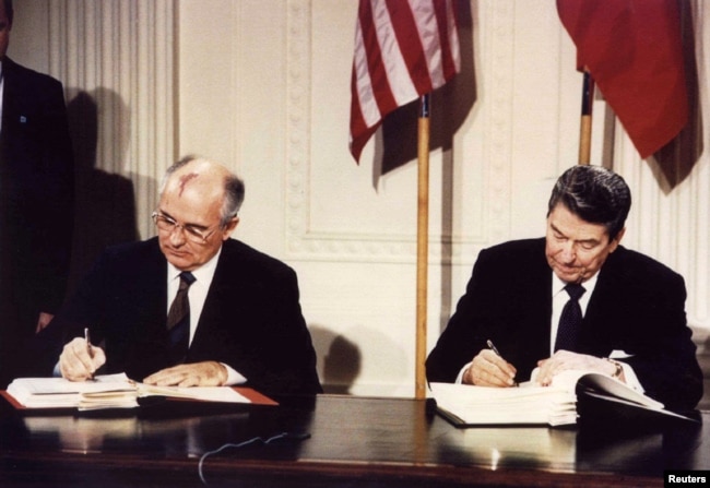 U.S. -- File photo of U.S. President Ronald Reagan (R) and Soviet President Mikhail Gorbachev the Intermediate-Range Nuclear Forces (INF) treaty at the White House, on December 8 1987