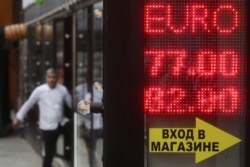 Russia -- A digital board displaying currency exchange rates in Moscow, March 8, 2020