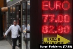 Russia -- A digital board displaying currency exchange rates in Moscow, March 8, 2020