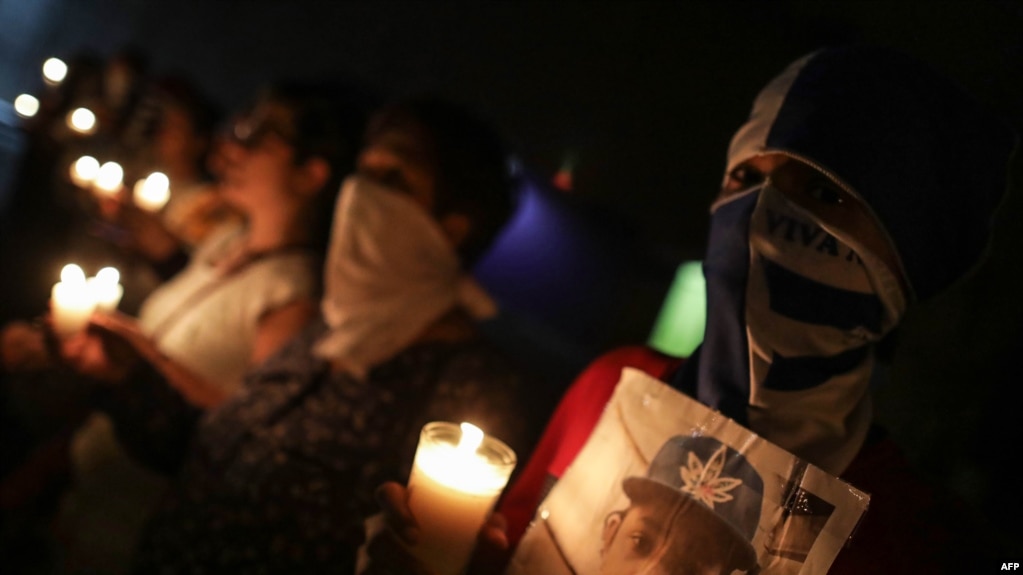 NICARAGUA – Anti-government demonstrators take part in a vigil to demand the release of political prisoners and justice for the victims of protests against President Daniel Ortega, outside the Metropolitan Cathedral of Managua on October 3, 2019.