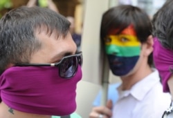 GEORGIA INTERNATIONAL DAY AGAINST HOMOPHOBIA -- Members of the LGBT (Lesbian, Gay, Bisexual and Transgender) Georgia community are seen during a small gay parade on the occasion of the International Day against Homophobia, in Tbilisi, Georgia, 17 May 2012.