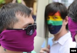 GEORGIA INTERNATIONAL DAY AGAINST HOMOPHOBIA -- Members of the LGBT (Lesbian, Gay, Bisexual and Transgender) Georgia community are seen during a small gay parade on the occasion of the International Day against Homophobia, in Tbilisi, Georgia, 17 May 2012.