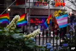 Flags affirming LGBTQ+ identity dress the fencing surrounding the Stonewall National Monument on June 22, 2022, in New York. (Bebeto Matthews/AP)