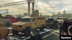 Syrian Trophy Train-- The vehicle with the black paintjob is a U.S. made Humvee