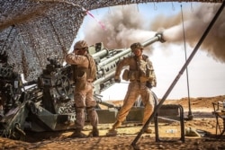 SYRIA - U.S. Marines with the 11th Marine Expeditionary Unit fire an M777 Howitzer during a fire mission in northern Syria as part of Operation Inherent Resolve, Mar. 24, 2017.