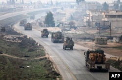 A Turkish military convoy driving through Syria's northwestern Idlib province, February 15, 2018.