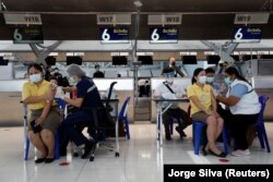 People get vaccinated against COVID-19 at Suvarnabhumi in Bangkok on April 28, 2021.