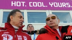 Russia -- Russian President Vladimir Putin (R) and Sports Minister Vitaly Mutko attend the event at the 2014 Sochi Winter Olympics, February 16, 2014