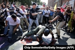 U.S. -- White nationalists, neo-Nazis and members of the "alt-right" clash with counter-protesters as they enter Emancipation Park during the "Unite the Right" rally in Charlottesville, Virginia, August 11, 2017.