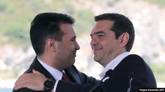 GREECE -- Greek Prime Minister Alexis Tsipras, right and his Macedonian counterpart Zoran Zaev, embrace during a signing of an agreement for Macedonia's new name in the village of Psarades, June 17, 2018