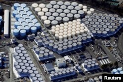 An aerial view shows the storage tanks for treated water at the tsunami-crippled Fukushima Daiichi nuclear power plant in Okuma town, Fukushima prefecture, on February 13, 2021.