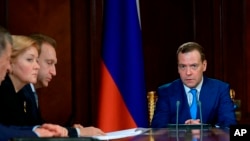 Russian Prime Minister Dmitry Medvedev leads a cabinet meeting, April 9, 2018. Medvedev ordered the cabinet to draw up measures to support the companies in the energy, metals and arms sectors that were sanctioned by the U.S. on April 6. 