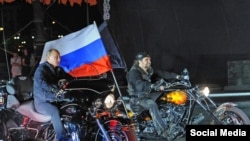 Russian President Vladimir Putin riding alongside the leader of the Night Wolves Alexander Zaltostanov aka the Surgeon