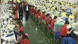 CHINA – In this file image from undated video footage run by China's CCTV, Muslim trainees work in a garment factory at the Hotan Vocational Education and Training Center in Hotan, Xinjiang.