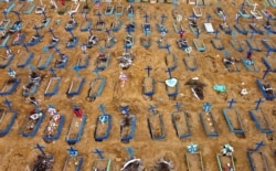 Brazil -- Aerial view of an area at the Nossa Senhora Aparecida cemetery where new graves have been dug in Manaus, Brazil, on May 22, 2020 amid the novel Covid-19 coronavirus pandemic.