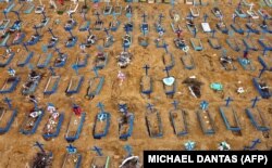 Brazil -- Aerial view of an area at the Nossa Senhora Aparecida cemetery where new graves have been dug in Manaus, Brazil, on May 22, 2020 amid the novel Covid-19 coronavirus pandemic.