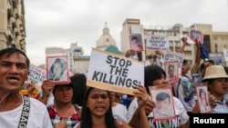Filipino activists and relatives of people killed in the country's war on drugs hold a rally in observance of Human Rights Day in Manila, on December 10, 2019. Reuters/Eloisa Lopez