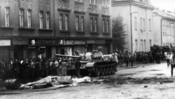 CZECHOSLOVAKIA -- A tank drives on a street during confrontations between demonstrators and the Warsaw Pact troops and tanks, August 1968
