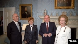 UK -- London, United Kingdom. Mikhail Gorbachev (2nd R), General Secretary of the Central Committee of the Communist Party of the Soviet Union, with his wife Raisa (2nd L) are welcomed by Margaret Thatcher (R), Prime Minister of the United Kingdom