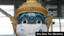 A Thai traditional giant statue wears a protective mask, amid the coronavirus disease (COVID-19) pandemic, at Suvarnabhumi Airport in Bangkok, Thailand December 15, 2020. 