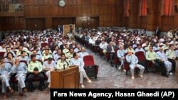 This photo released by the semi-official Iranian Fars News Agency, shows a general view of the court room where dozens of opposition activists and protesters stood trial in Tehran's Revolutionary Court on Tuesday, August 25, 2009.