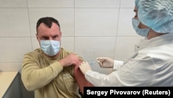 A Russian Army service member receives an injection with Sputnik V (Gam-COVID-Vac) vaccine against the coronavirus disease (COVID-19) at a clinic in the city of Rostov-On-Don, Russia, on December 22, 2020.