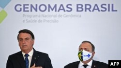 President Jair Bolsonaro and Brazilian Health Minister Eduardo Pazuello attend a ceremony to launch the Genomas Project at Planalto Palace in Brasilia, on October 14, 2020.