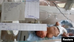 A four day-old baby lies in an intensive care unit in a Moscow hospital October 2011. Fertility rates in Russia fell in 2017, perhaps marking the end of an era of generally improving public health in Russia.