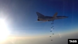 Syria - A Russian Tupolev Tu-22M3 long-range bomber drops off bombs at an unknown location in Syria, August 11, 2016
