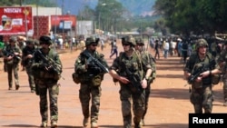 French soldiers are seen patrolling a street in Bangui on December 8, 2013. (Herve Serefio/Reuters)