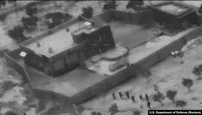 SYRIA -- U.S. special forces move towards the compound of Islamic State leader Abu Bakr al-Baghdadi during a raid in the Idlib region of Syria in a still image from video October 26, 2019
