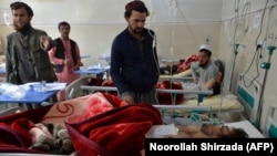 AFGHANISTAN -- Afghan victims receive medical treatment at a hospital following a suicide attack on a private construction company in Jalalabad, March 6, 2019