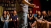 In this May 24, 2015 photo, audience laugh as a standup comedian performs during a comedy show at a bookstore in Beijing. Western-style standup comedy is a small yet growing scene in China that reflects wider changes toward more cultural freedom. (AP/Mark Schiefelbein)
