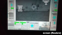 UKRAINE – A screen shows a Russian border guard vessel trying to stop a Ukrainian Navy tug boat as three Ukrainian ships make a journey from the Black Sea port of Odessa via the Kerch Strait to Mariupol on the Sea of Azov. 25Nov2018