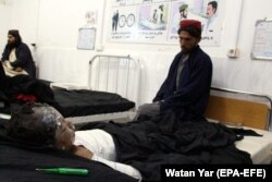 AFGHANISTAN -- An injured boy receives treatment at a hospital after an air strike in Helmand province, November 29, 2018.
