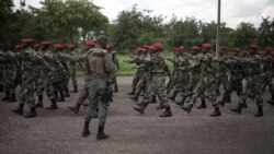 New recruits for the Central African Armed Forces (FACA) march in formation during an award presentation in Berengo, CAR on August 4, 2018.