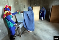 Afghan women cast their ballots during the presidential elections run-off in Herat, 2014.