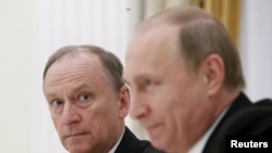 Russian Security Council Secretary Nikolai Patrushev (L) and President Vladimir Putin