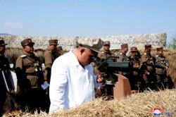 NORTH KOREA -- North Korean leader Kim Jong Un guides a drill of mortar sub-units of North Korean Army, April 9, 2020