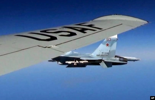 A U.S. RC-135U flying in international airspace over the Baltic Sea is intercepted by a Russian SU-27 Flanker on June 19, 2017.