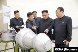 North Korean leader Kim Jong-Un examines what could be a thermonuclear warhead. Image is provided by the Korean Central News Agency in Pyongyang on September 3, 2017 and is not verified.