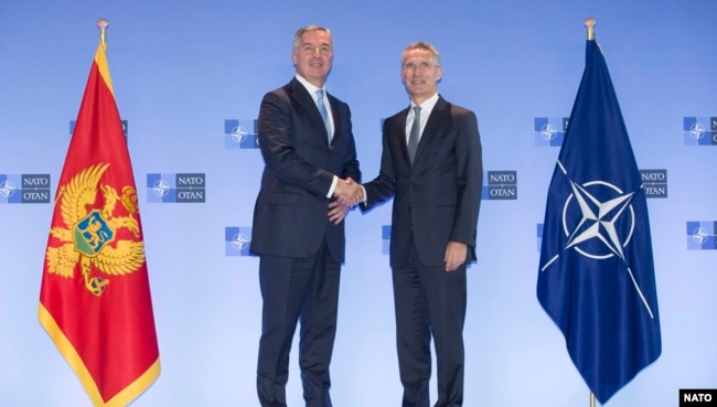 NATO secretary-general Jens Stoltenberg (R) meets with Montenegrin President Milo Dukanovic in Brussels, June 4, 2018
